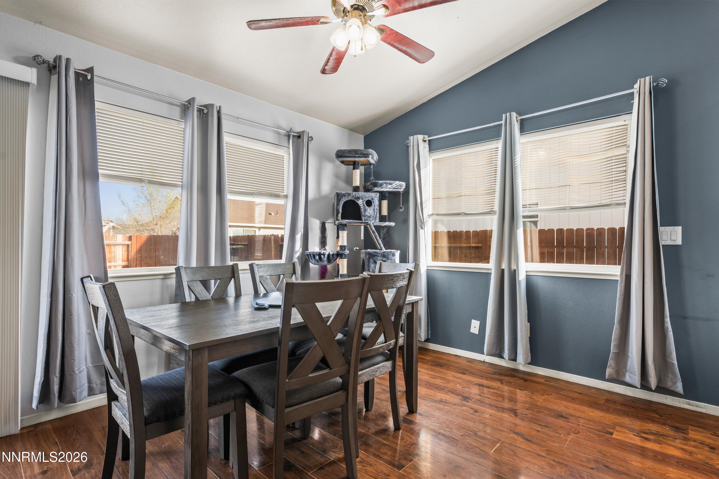 712 Hastings Way Fernley, NV 89408 - Photo 17 of 36 a view of a dining room with furniture window and wooden floor