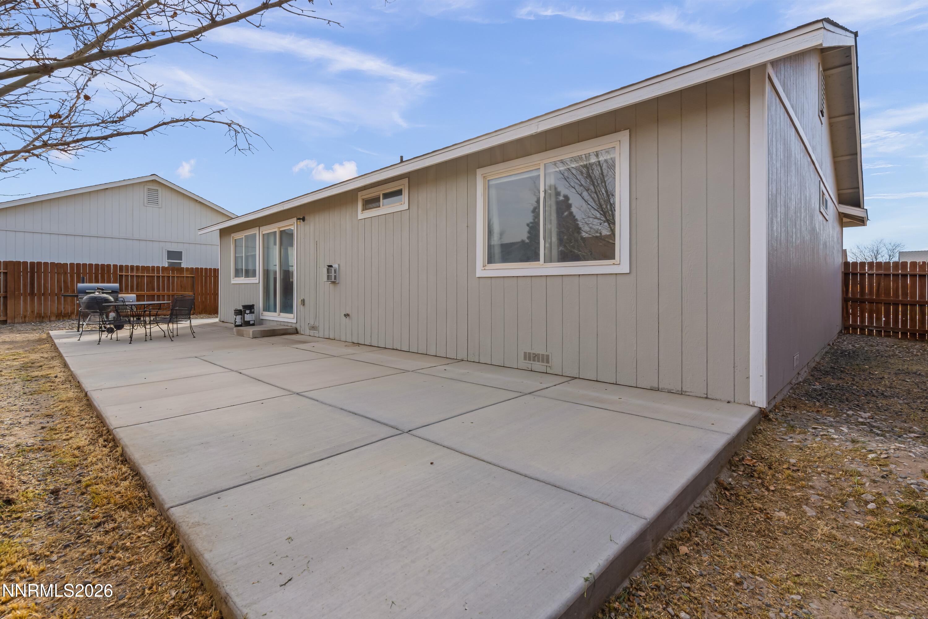 712 Hastings Way Fernley, NV 89408 - Photo 23 of 36 a backyard of a house with table and chairs