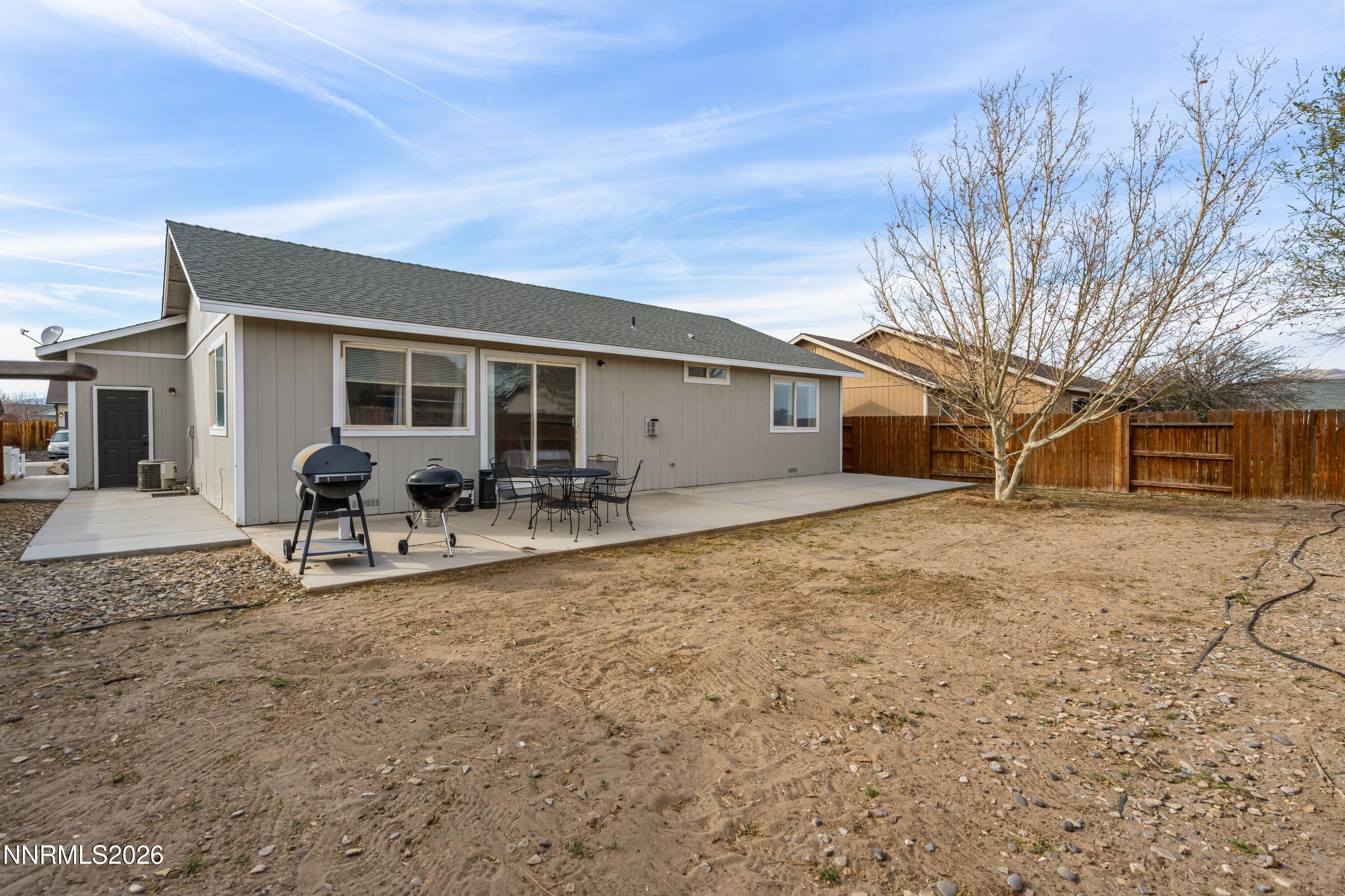 712 Hastings Way Fernley, NV 89408 - Photo 25 of 36 a view of a house with backyard and sitting area
