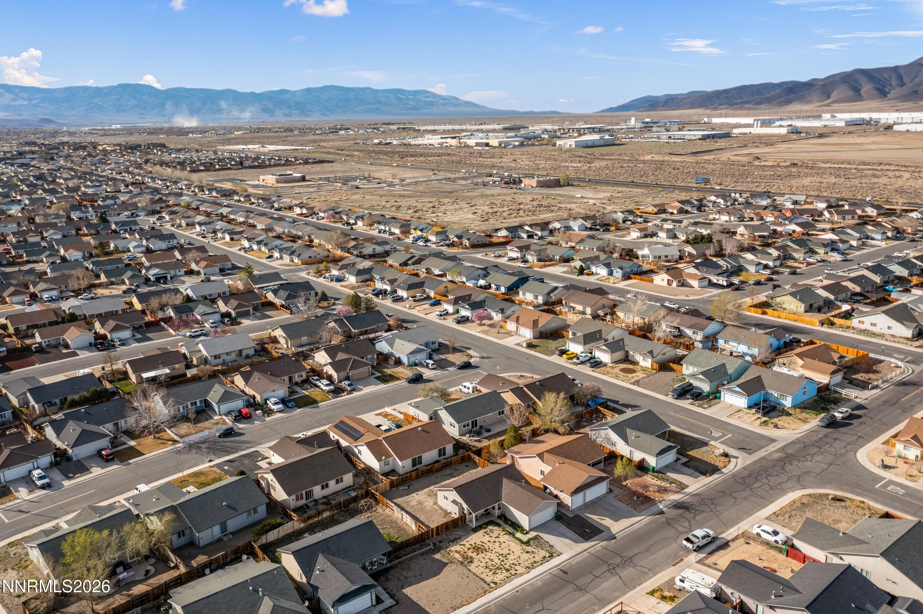 712 Hastings Way Fernley, NV 89408 - Photo 32 of 36 an aerial view of residential building with outdoor space