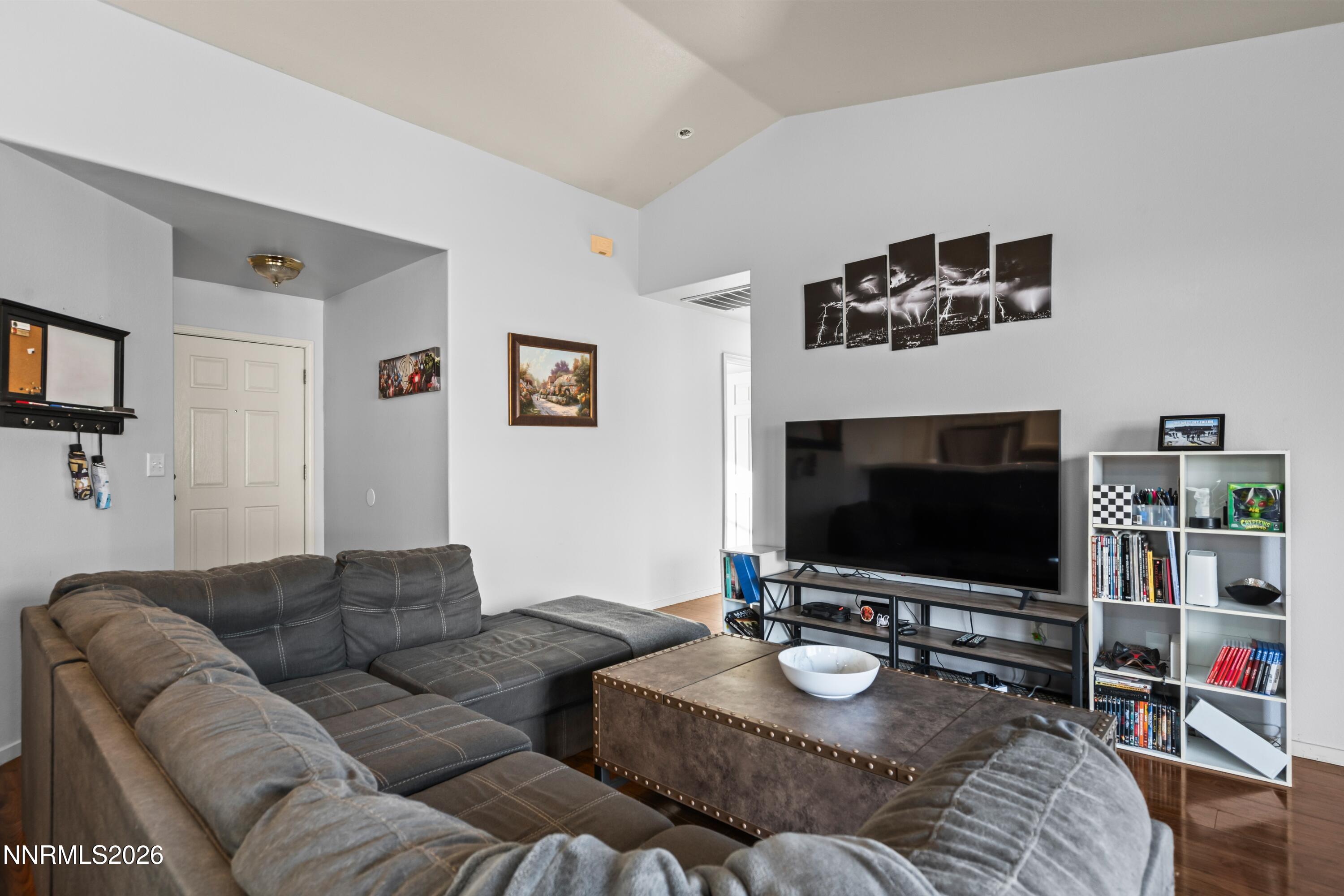 712 Hastings Way Fernley, NV 89408 - Photo 8 of 36 a living room with furniture and a flat screen tv