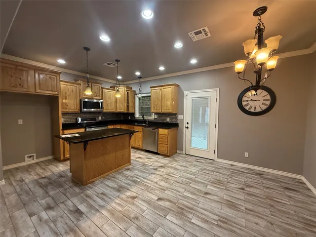 a view of a living room and floor to ceiling window