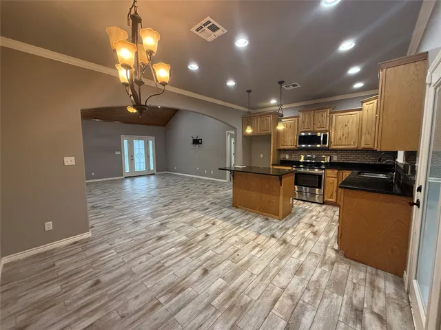 a bathroom with a tub a sink and a shower