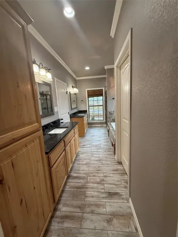 a view of a room with wooden floor