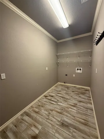 a kitchen with stainless steel appliances granite countertop a refrigerator a stove top oven and a sink