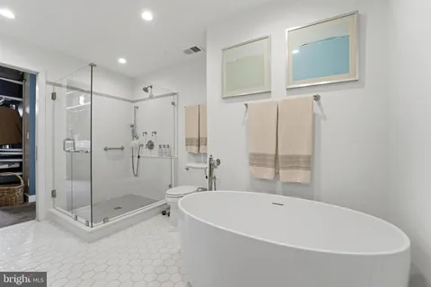a bathroom with a bathtub and a sink