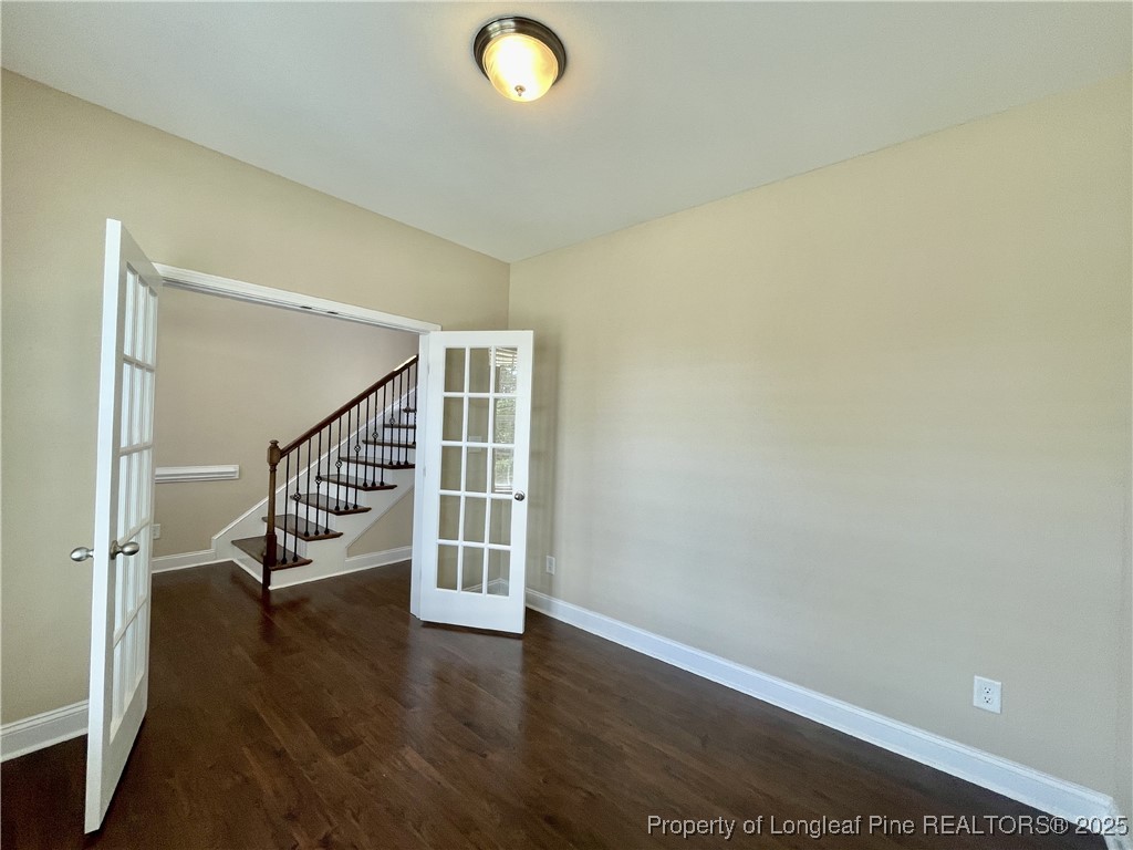 608 Stonebriar Avenue Raeford, NC 28376 - Photo 26 of 29 an empty room with wooden floor and windows