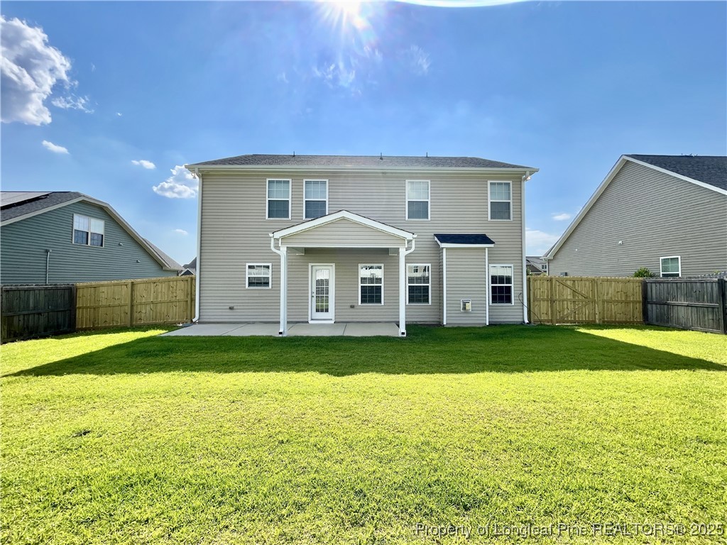 608 Stonebriar Avenue Raeford, NC 28376 - Photo 29 of 29 a front view of a house with a yard and garage
