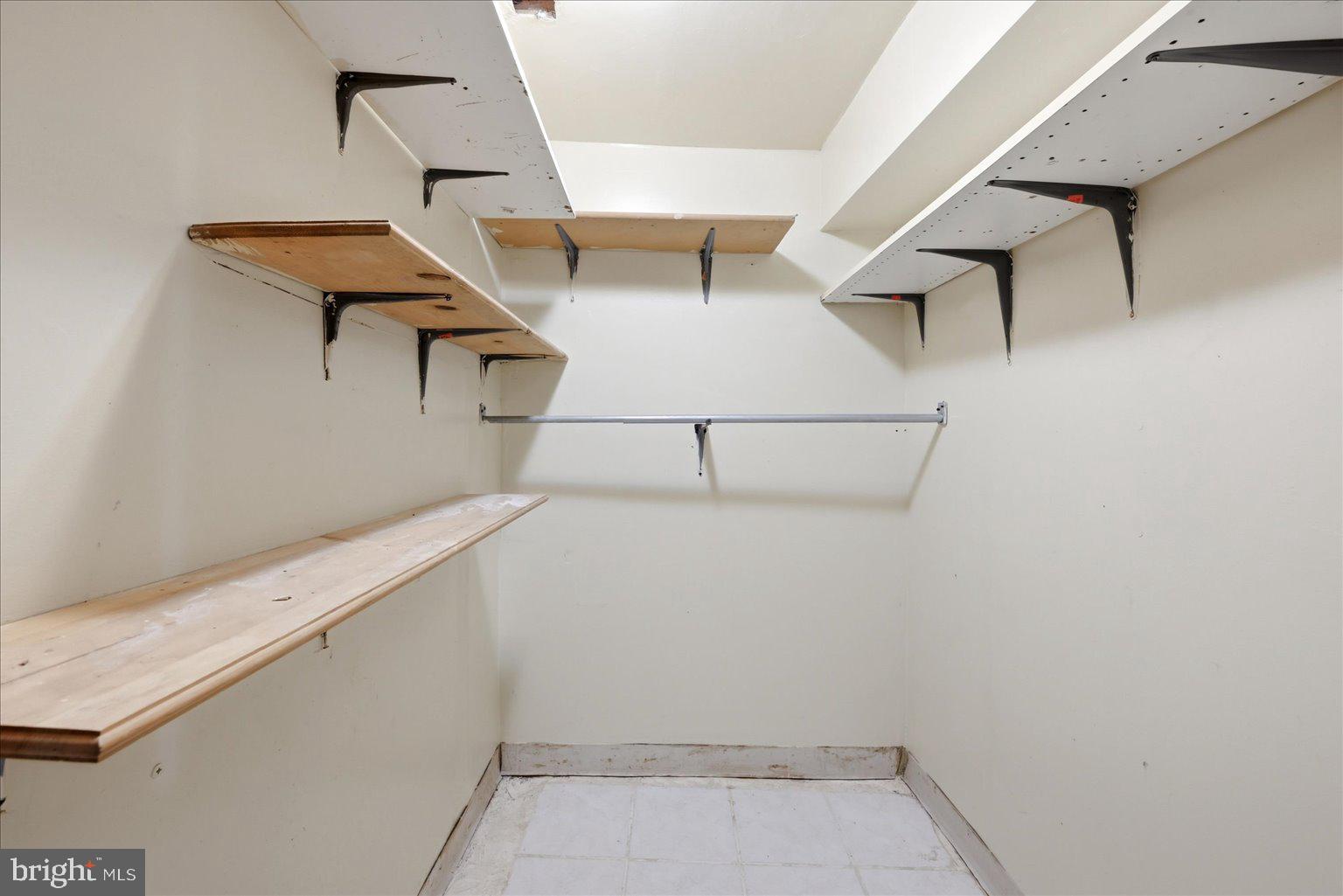 9110 Meadow Heights Road Randallstown, MD 21133 - Photo 32 of 39 Spacious closet with ample shelving.