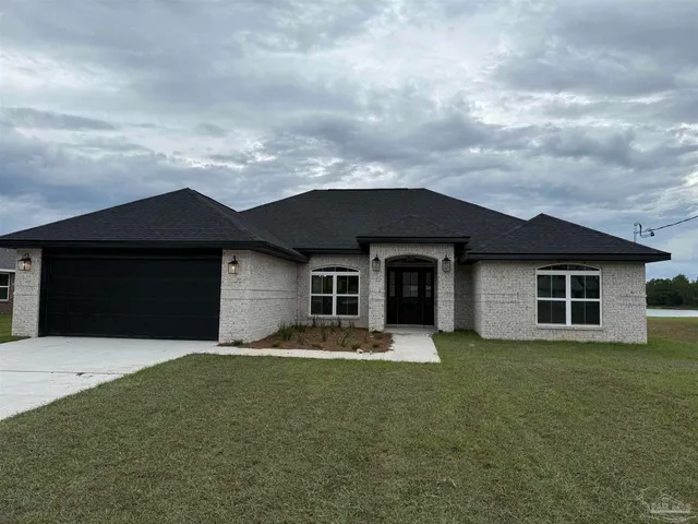front view of a house with a yard
