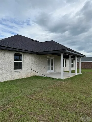 front view of a house with a big yard