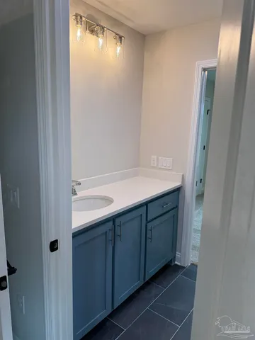 an empty room with wooden floor and closet