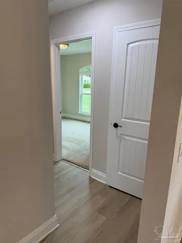 a kitchen with a sink and chandelier