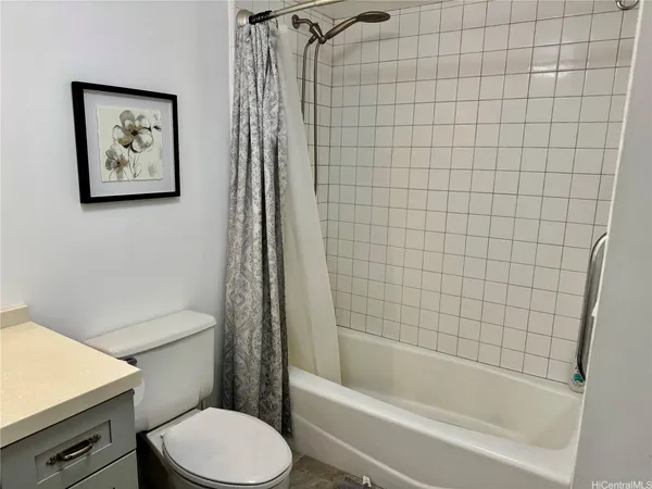 a bathroom with a toilet and a bathtub