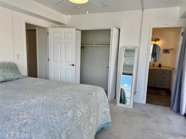 a bedroom with a bed and a sink