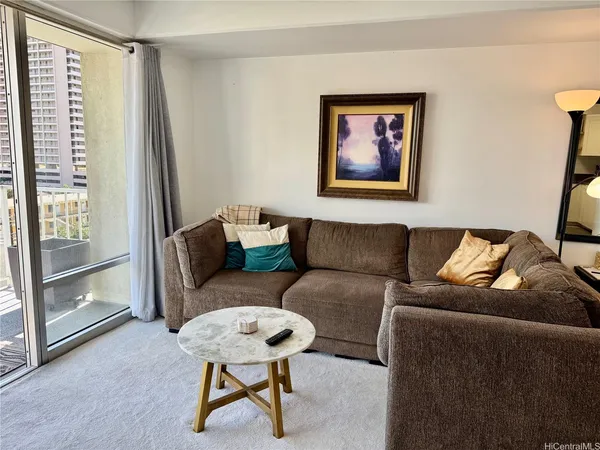 a living room with furniture and a window