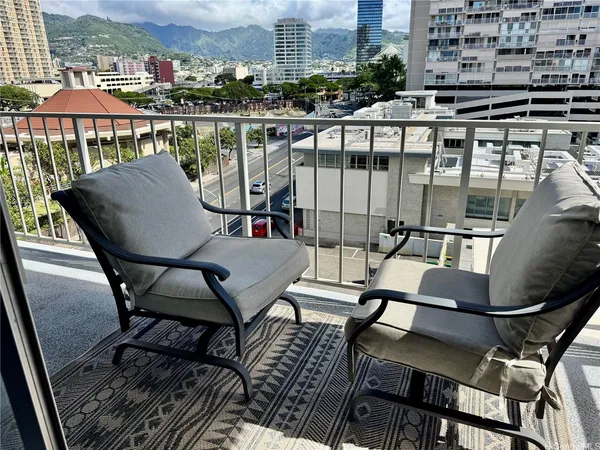 a view of a chairs and table in patio