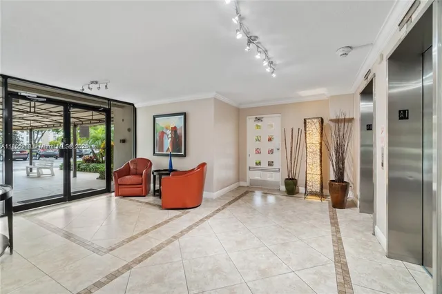 a bedroom with furniture and large windows