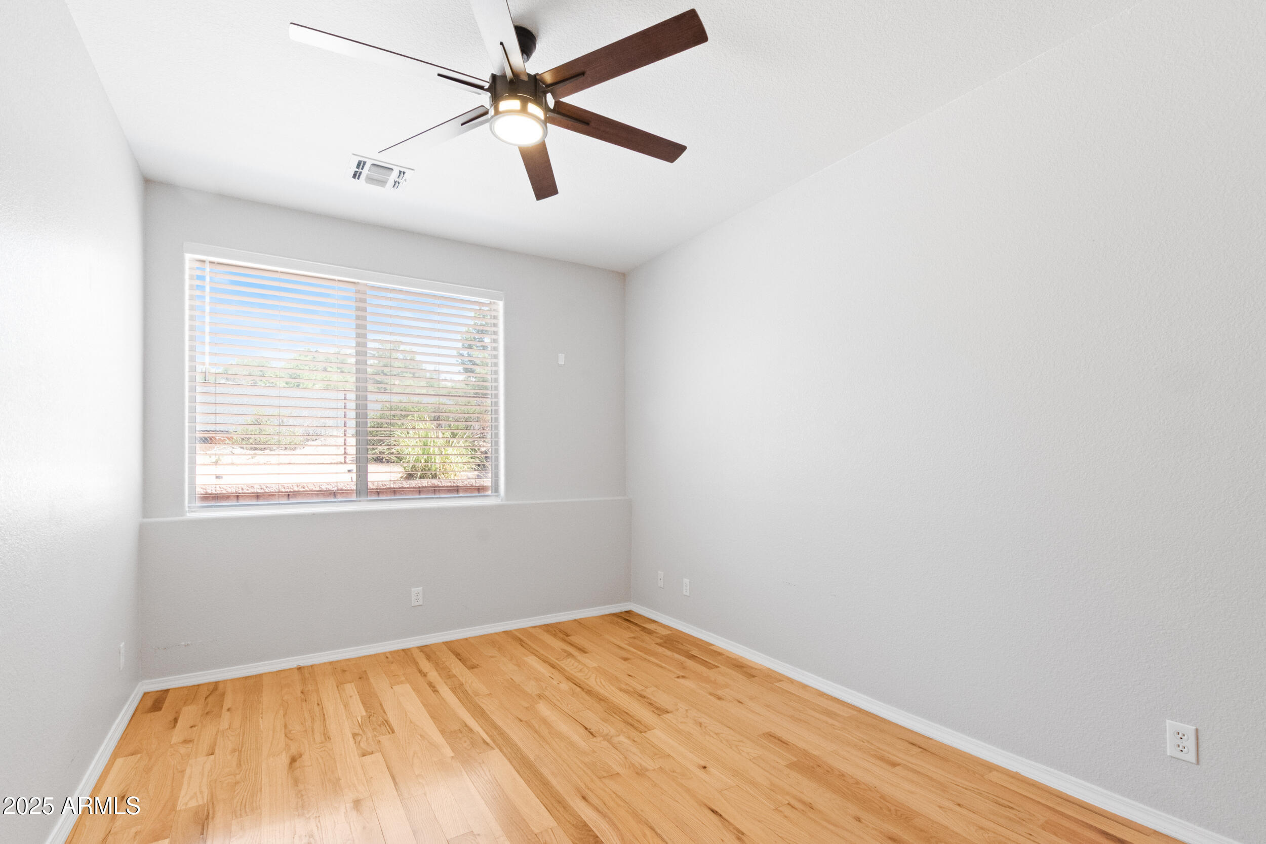 102 South Whiting Drive Payson, AZ 85541 - Photo 23 of 30 an empty room with a window and a fan