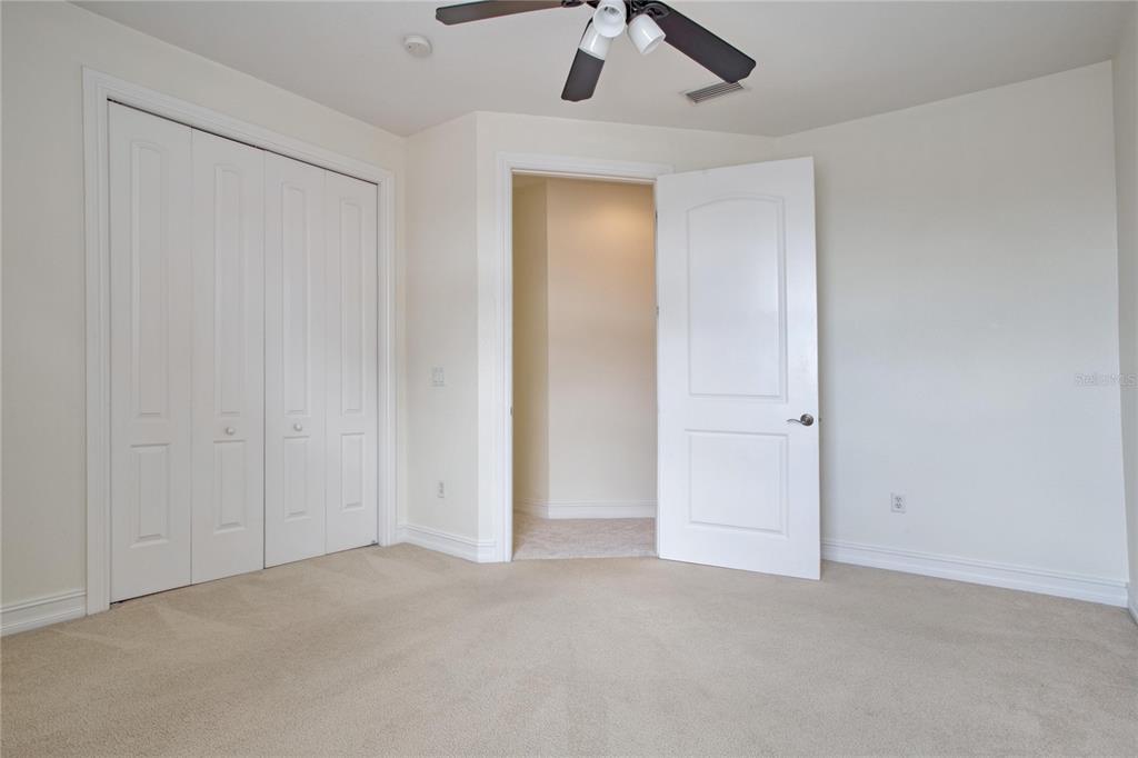 1344 Ribolla Drive Palm Harbor, FL 34683 - Photo 22 of 26 an empty room with ceiling fan