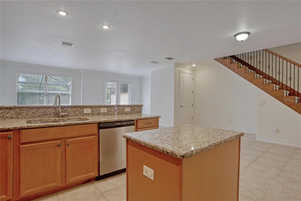 1344 Ribolla Drive Palm Harbor, FL 34683 - Photo 5 of 26 a bathroom with a granite countertop sink and a mirror