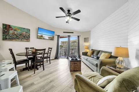 a living room with furniture and a lamp