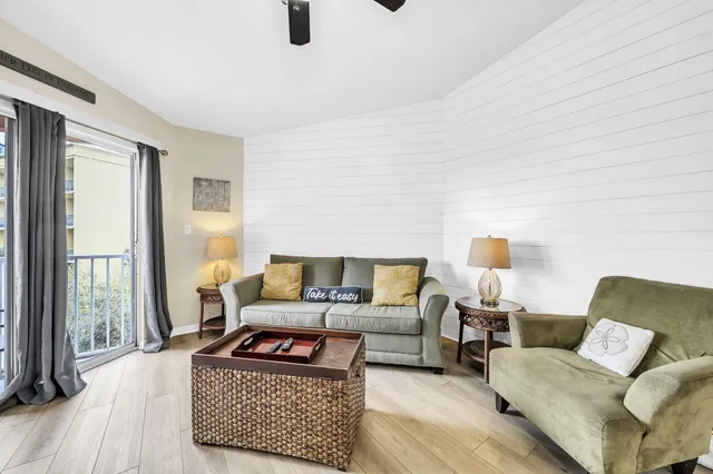 a living room with furniture and a lamp