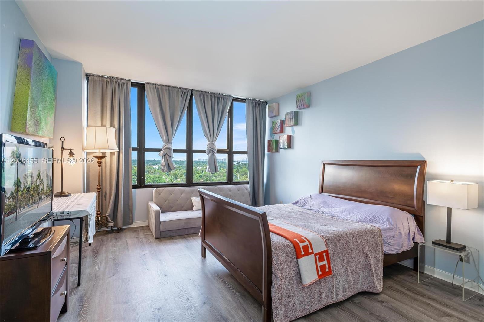 780 Northeast 69th Street, Unit 1010 Miami, FL 33138 - Photo 27 of 31 a bed room with a bed and a couch