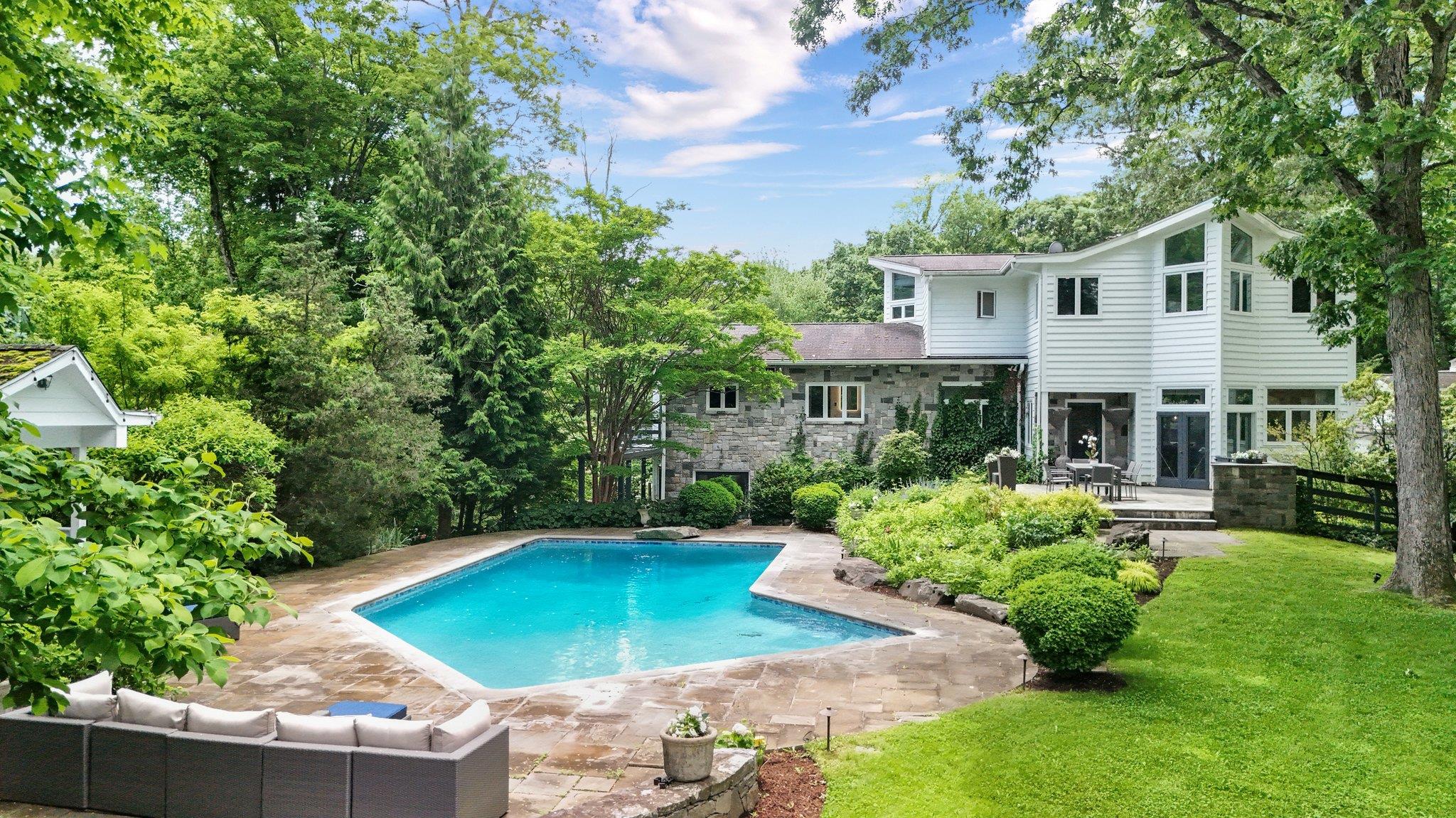 652 Long Hill Road West Briarcliff Manor, NY 10510 - Photo 1 of 1 a view of a house with swimming pool and sitting area
