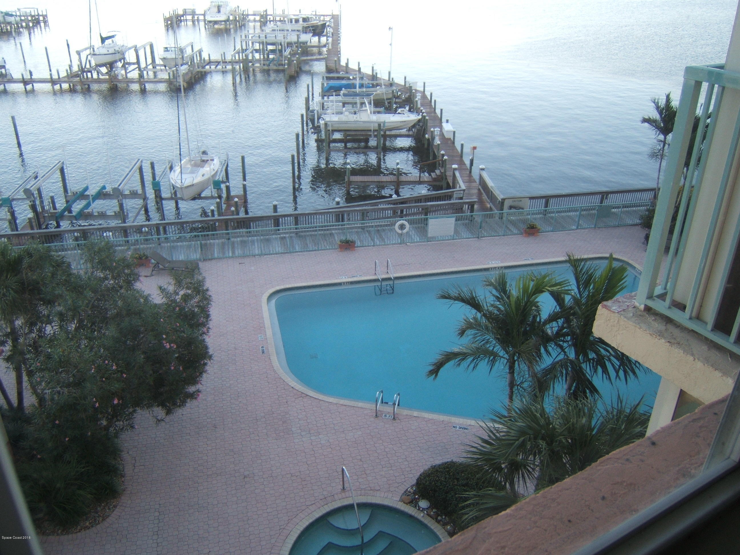 102 Riverside Drive, Unit 403 Cocoa, FL 32922 - Photo 20 of 33 View of Pool from Master Bedroom