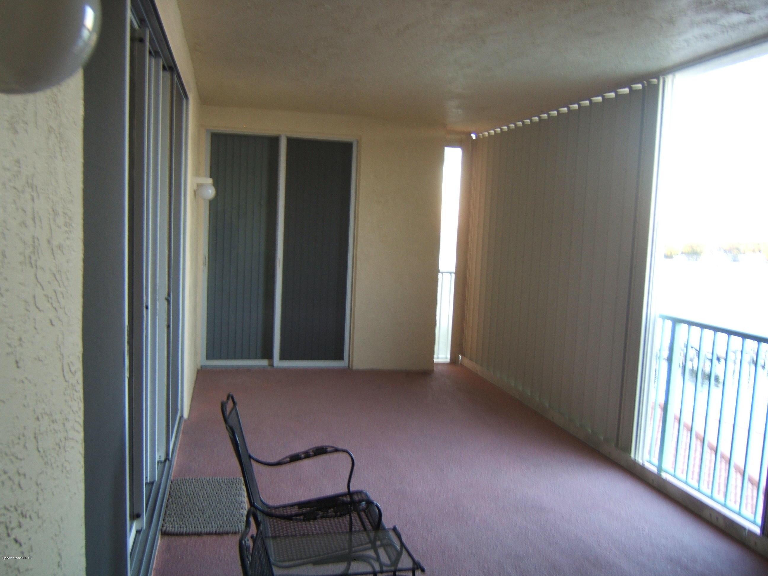 102 Riverside Drive, Unit 403 Cocoa, FL 32922 - Photo 30 of 33 Master Bedroom Sliders to Large Porch
