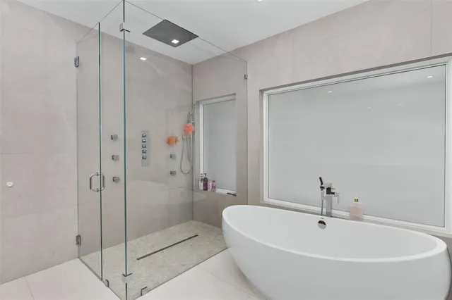 a view of a patio with a chairs and potted plants