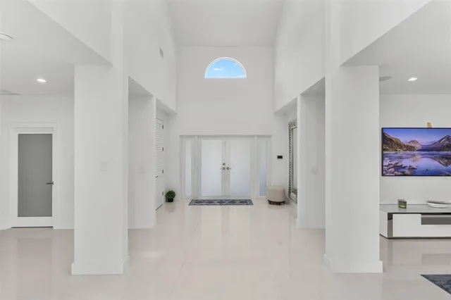 a kitchen with counter top space and living room