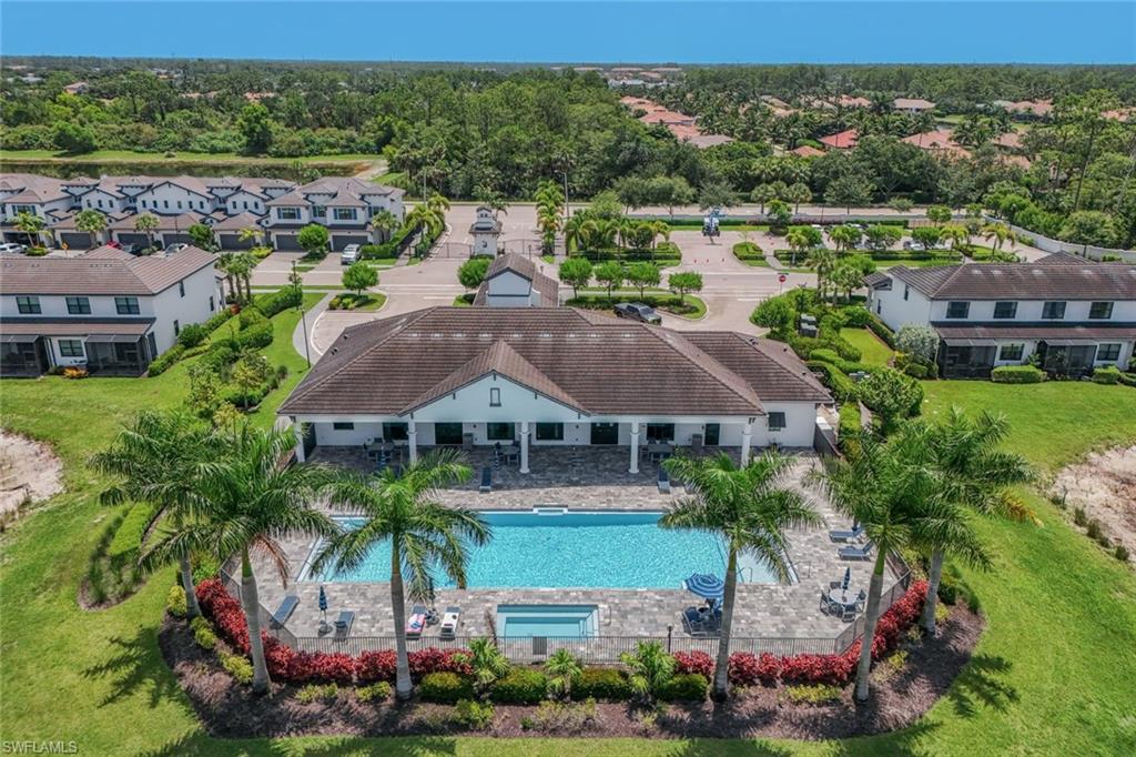 7348 Rockefeller Drive Naples, FL 34119 - Photo 31 of 39 Clubhouse & Community Pool