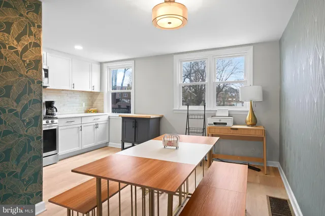 a kitchen that has a sink and a stove in it