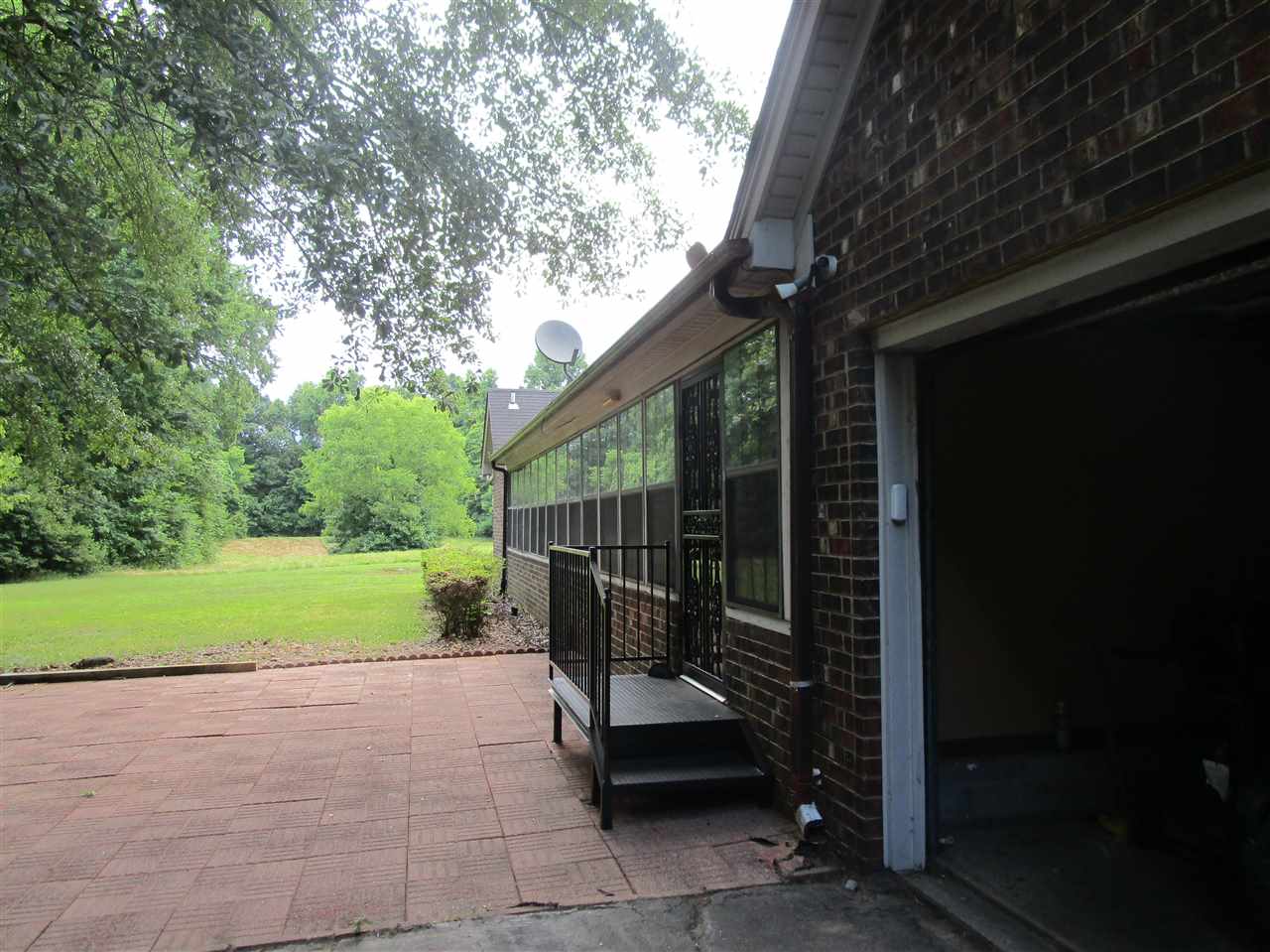 Super Patio and Sun room (47x10) all across back of the home. Rear Load attached garage