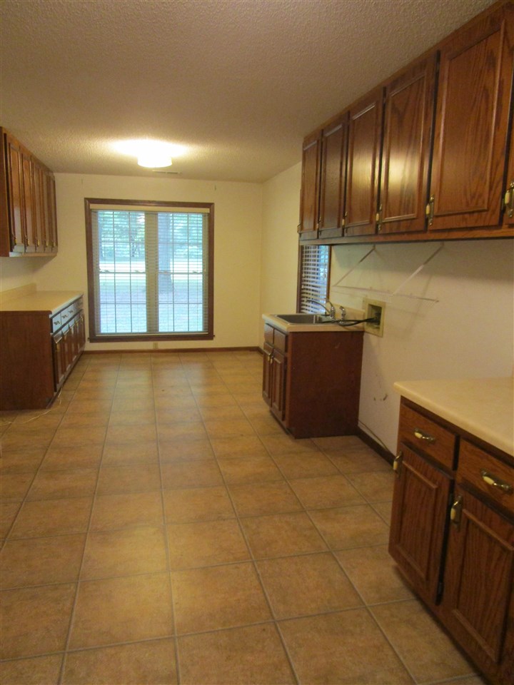 9711 Monasco Road Millington, TN 38053 - Photo 9 of 19 25x10 this room can be of so many uses as well as laundry. Crafts and Sewing can really be accomplished with this much space There are also 2 5x5 pantries located just off this area