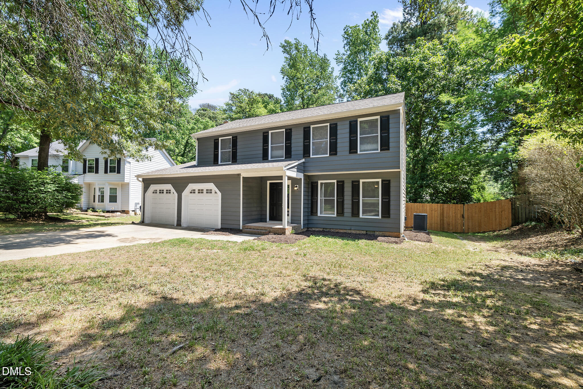 2108 Treverton Place Raleigh, NC 27609 - Photo 3 of 30 a front view of a house with a yard and garage