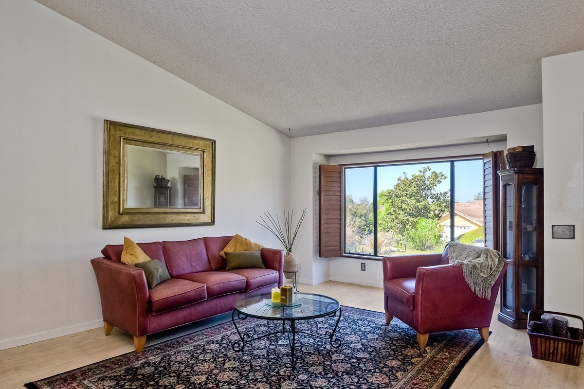 745 Winding Way Encinitas, CA 92024 - Photo 4 of 25 This charming living room is blessed with amazing breezes through the front windows - a perfect place to curl up and read your favorite book!