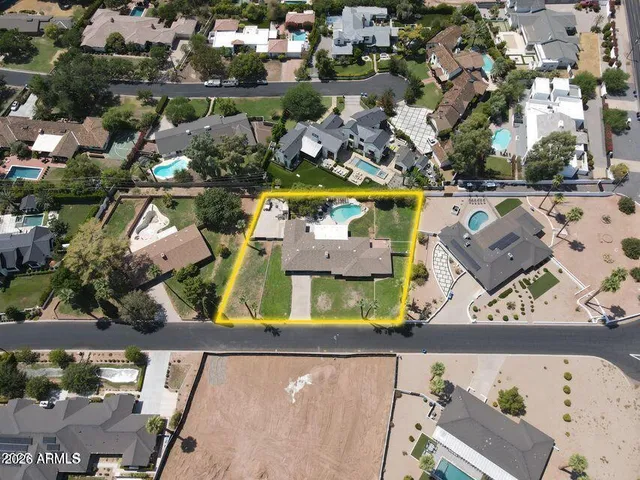 an aerial view of houses with yard