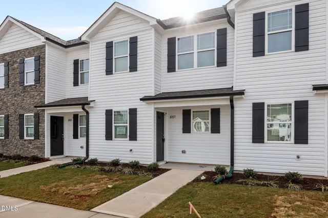 a picture of a bathroom with a shower and a sink