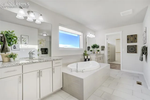 a bathroom with a sink a vanity and mirror