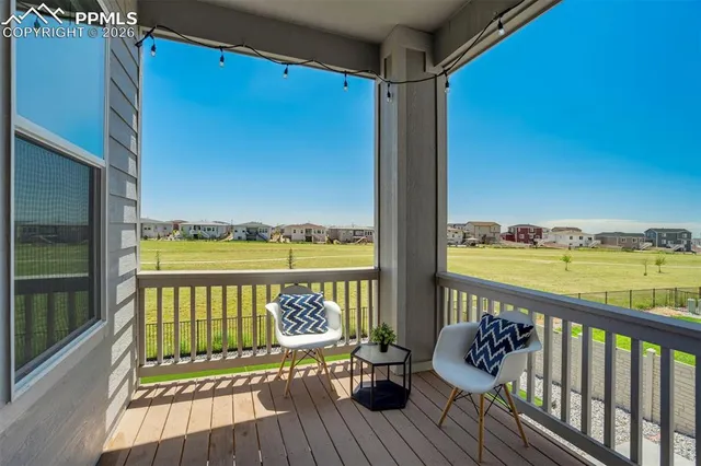 a view of a porch with wooden floor
