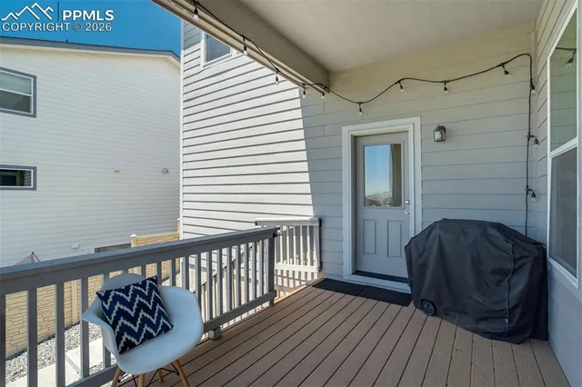 a view of a garden with lawn chairs