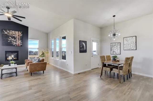 a living room with furniture and a dining room