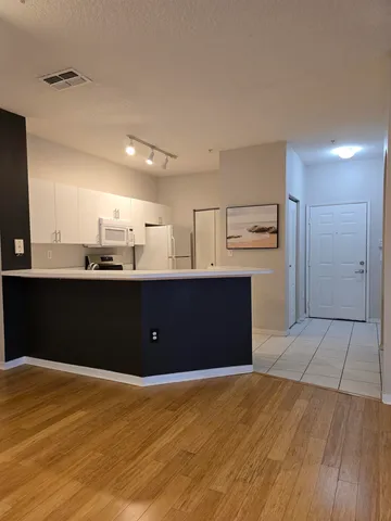 a view of room window and wooden floor