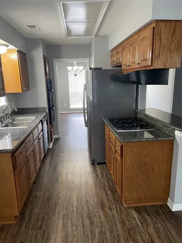 a view of a livingroom with wooden floor