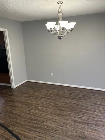 a view of a livingroom with wooden floor