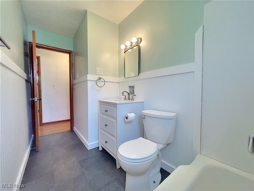24000 Knickerbocker Road Bay Village, OH 44140 - Photo 16 of 27 Bathroom featuring tile patterned floors, toilet, and vanity
