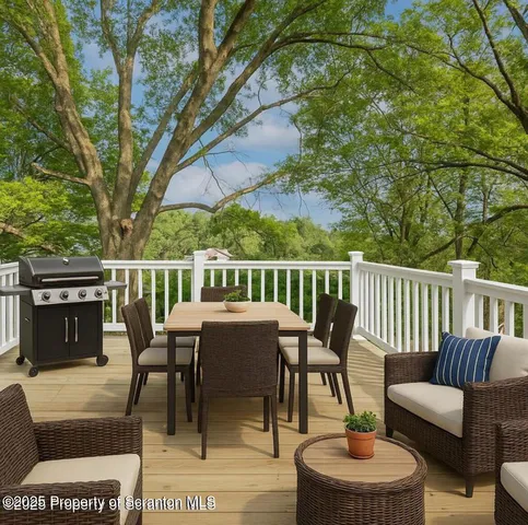 a view of balcony with wooden floor and fence